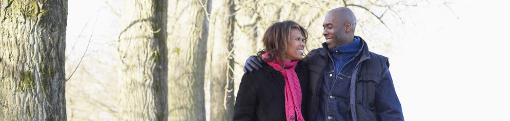 Black couple in winter clothing smiling after male fertility testing | Tennessee Reproductive Medicine | Chattanooga