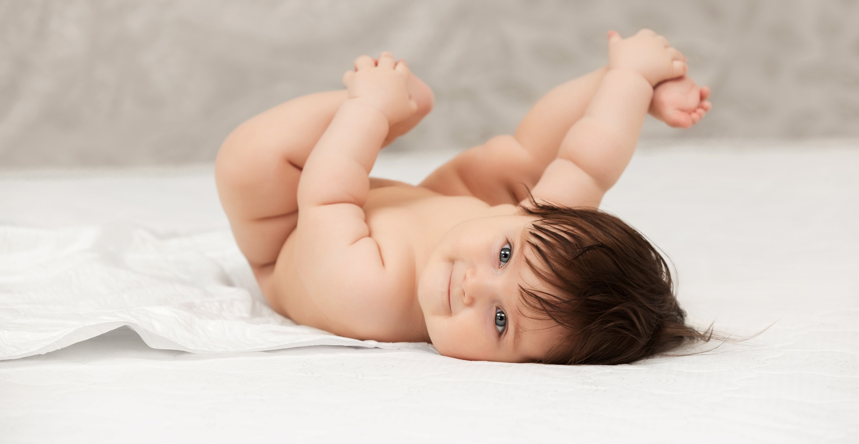 Baby girl lying on blanket at home | Treatment satisfaction survey | Tennessee Reproductive Medicine | Chattanooga