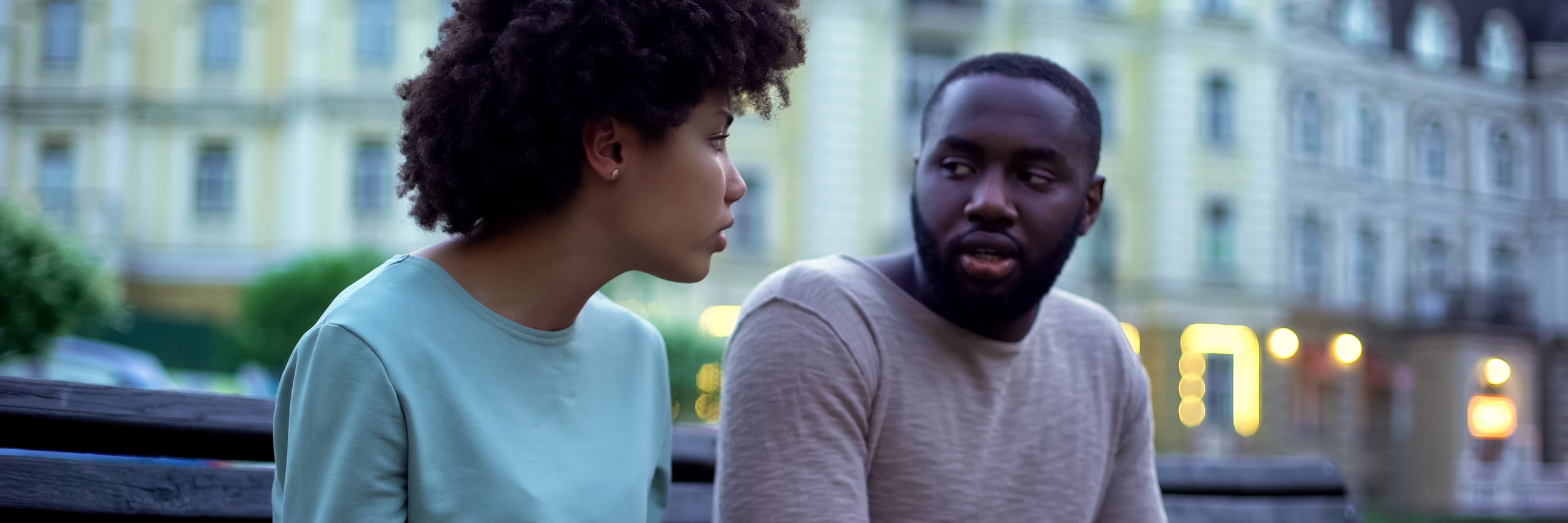 Black couple sitting on a bench discussing superovulation TRM | Chattanooga, TN