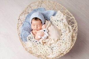 Cute baby in a basket born through mini-IVF, a low IVF cost option | Tennessee Reproductive Medicine | Chattanooga, TN