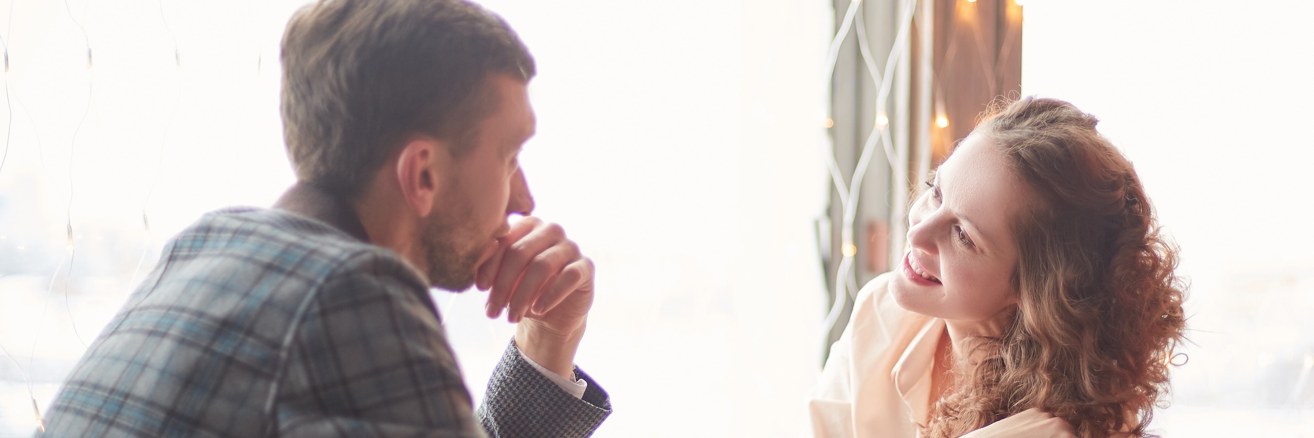 Young couple in a restaurant talking about fertility preservation & family planning | TRM | Chattanooga, TN