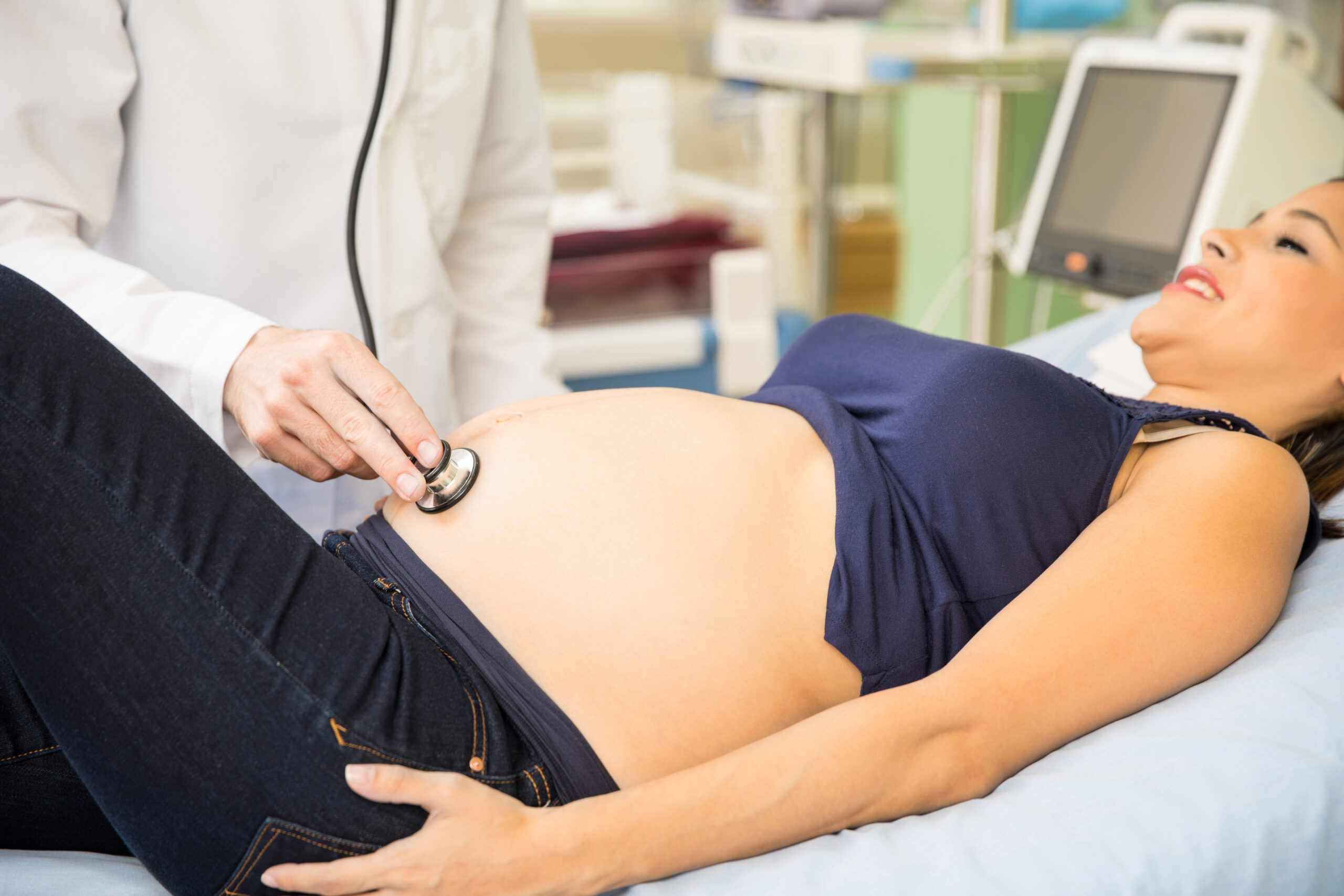 Doctor checking a pregnant woman for preeclampsia complications | Tennessee Reproductive Medicine | Chattanooga, TN