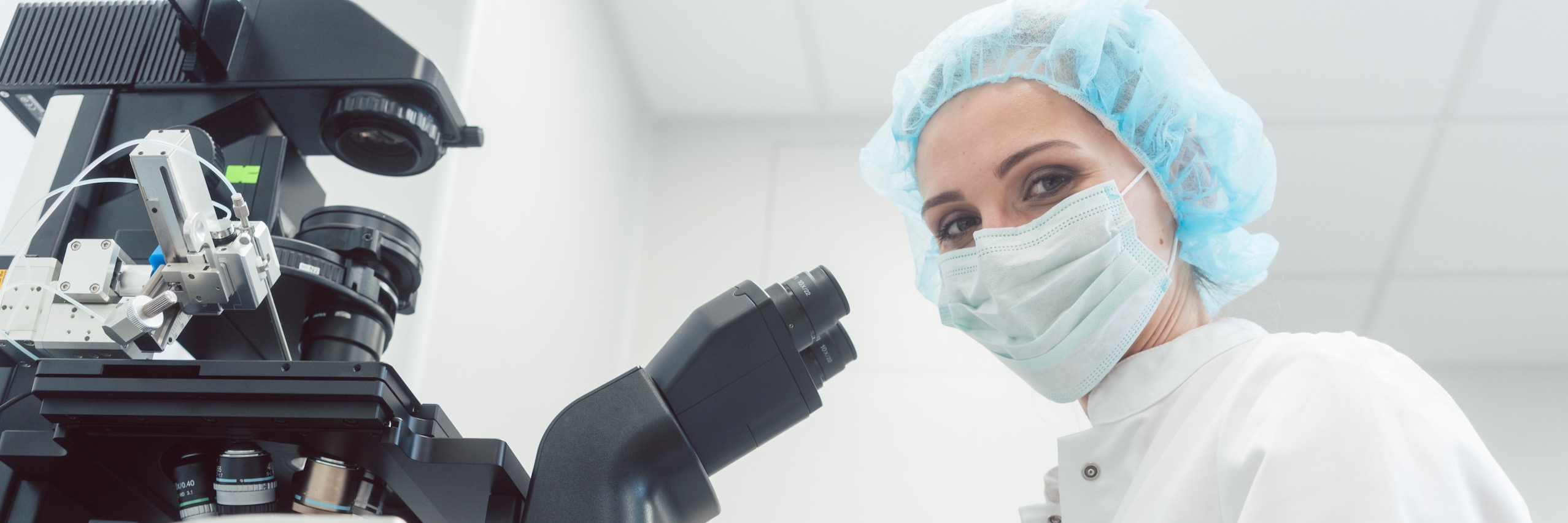 IVF lab technician at microscope to examine a blastocyst stage embryo | TRM | Chattanooga, TN