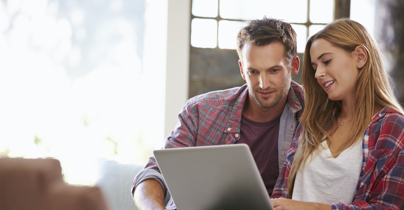 Couple looking at laptop showing our IVF financing options | Tennessee Reproductive Medicine | Chattanooga