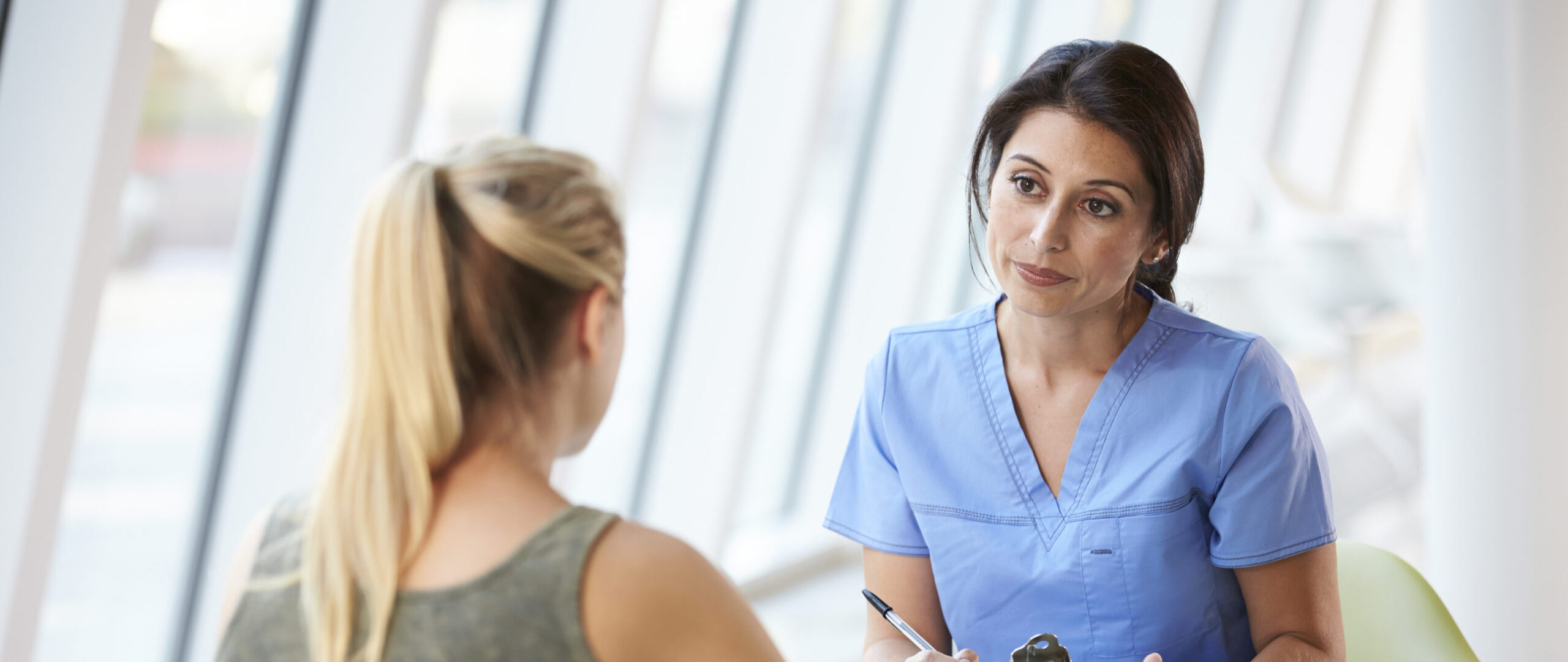 nurse reviewing application of woman providing donated eggs | Tennessee Reproductive Medicine | Chattanooga, TN