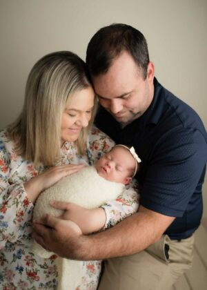 Carrie & Trent holding Harper Ann after their journey TTC | Tennessee Reproductive Medicine | Chattanooga