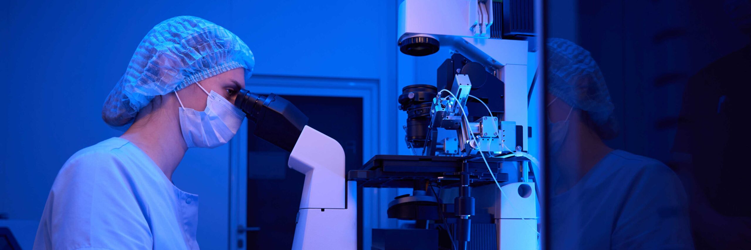 Embryologist performs an assisted hatching under a microscope | Tennessee Reproductive Medicine | Chattanooga, TN