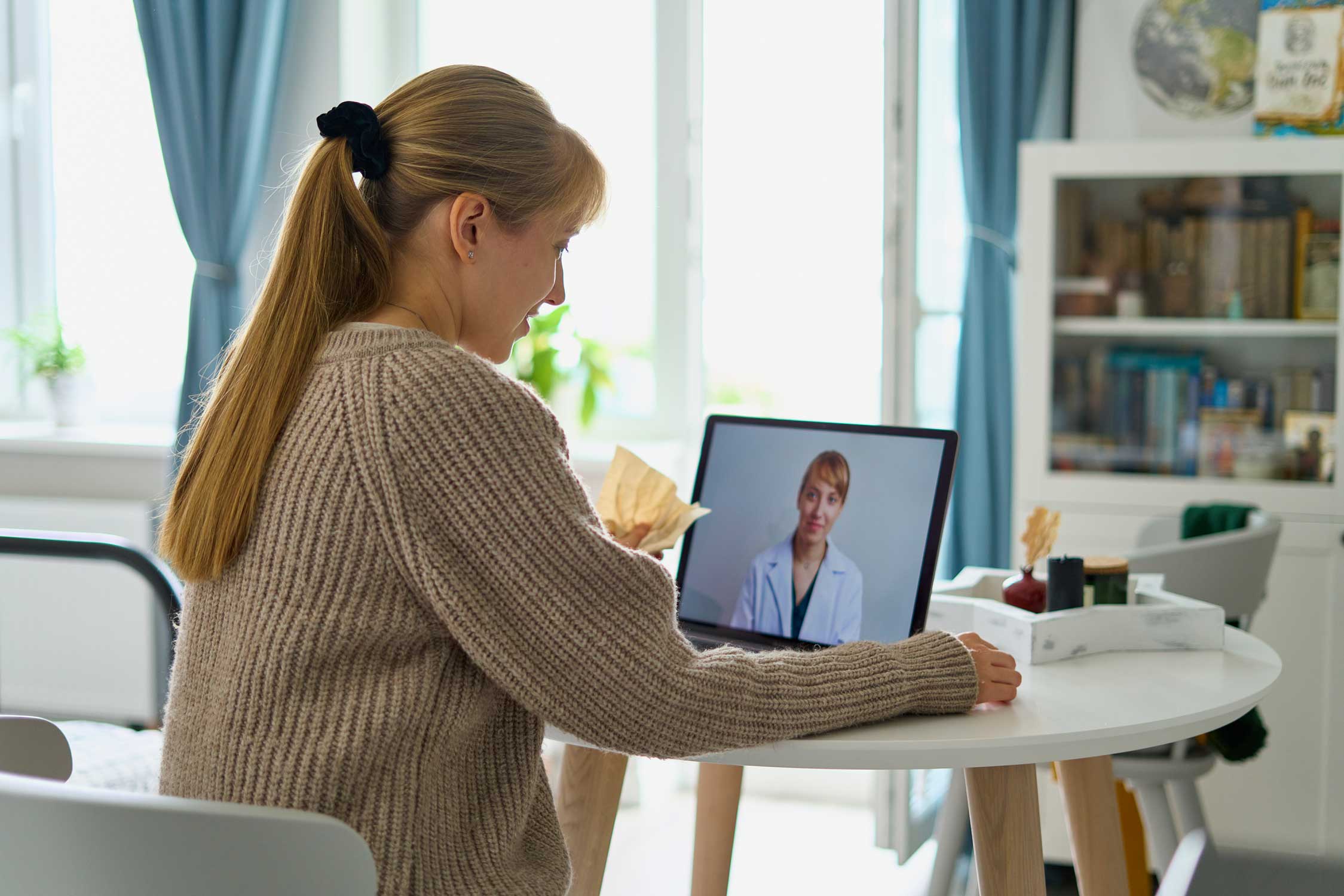 Woman on computer for telemedicine appointment | Nashville Fertility Clinic patients | Tennessee Reproductive Medicine