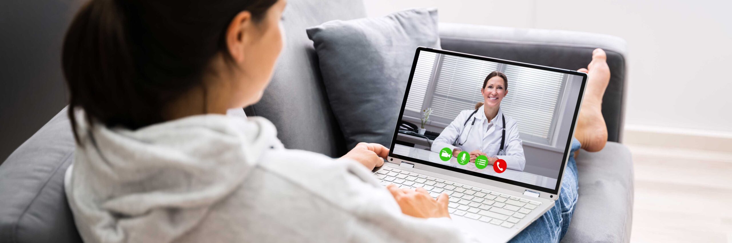 Women using a laptop has a fertility telemedicine appointment at Tennessee Reproductive Medicine | Chattanooga, TN